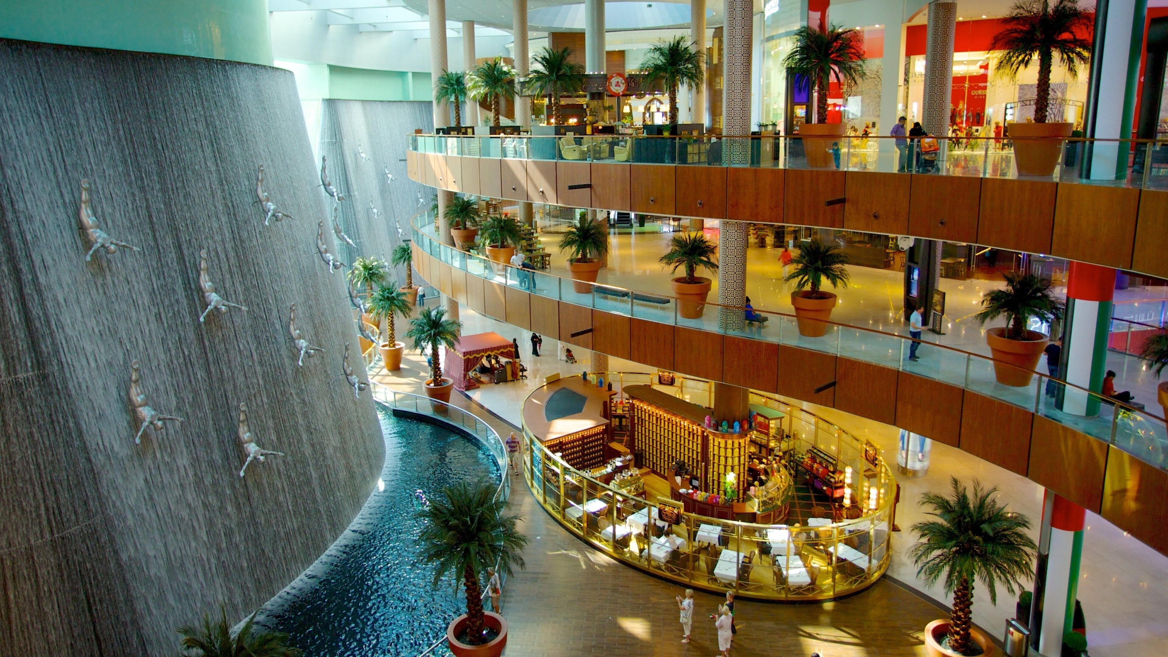 Interior of Dubai Mall with fountains and shoppers